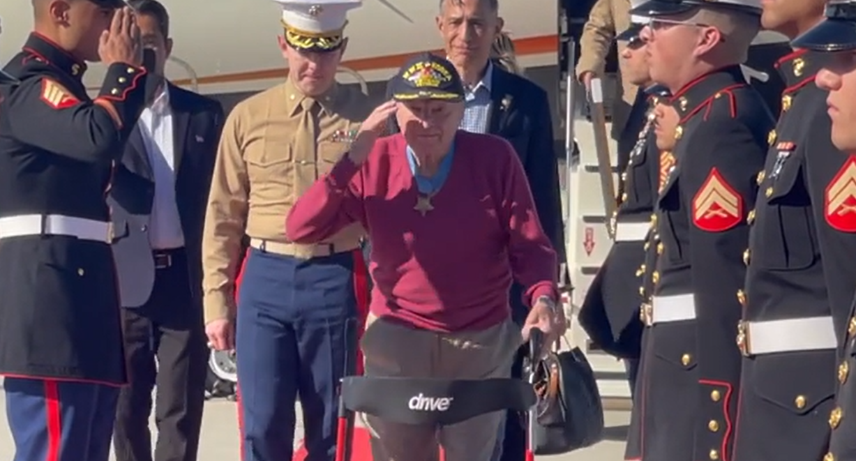 Marines salute Captain Williams wearing the Medal of Honor